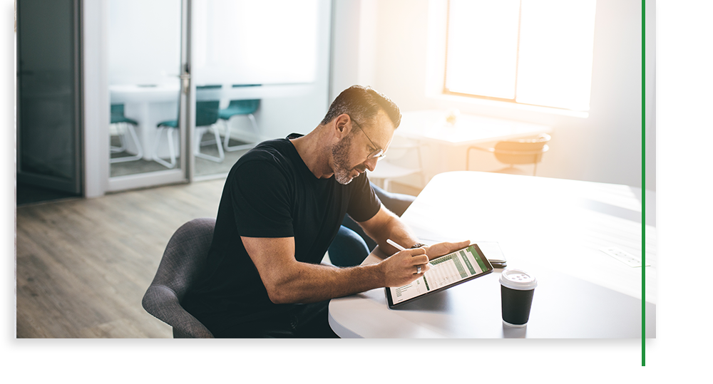 man researching on a tablet