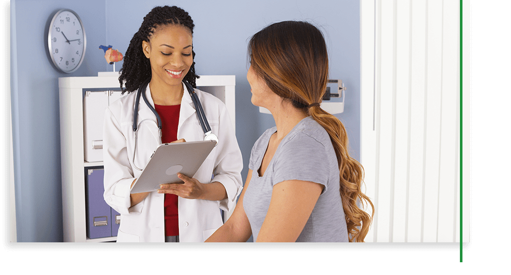 female doctor speaking with female patient