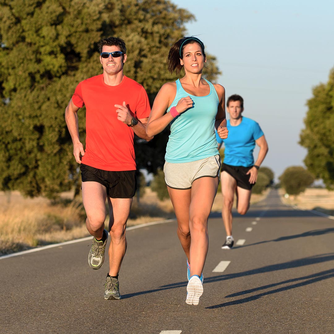 Happy men and woman running